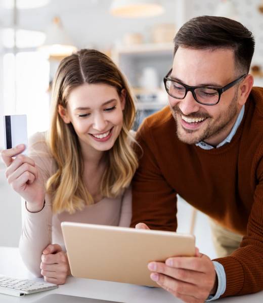 happy-smiling-couple-shopping-online-at-home-tech-2021-09-03-00-39-36-utc (1)